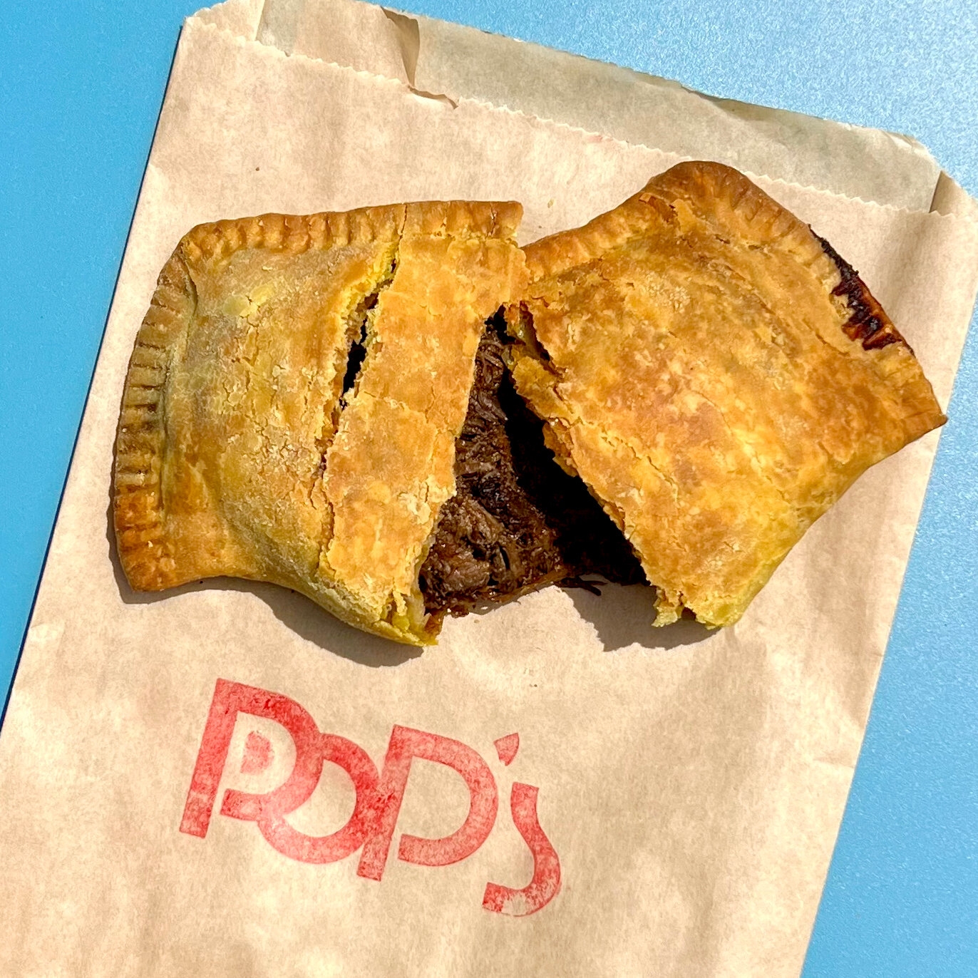 meat filled puff nyt crossword